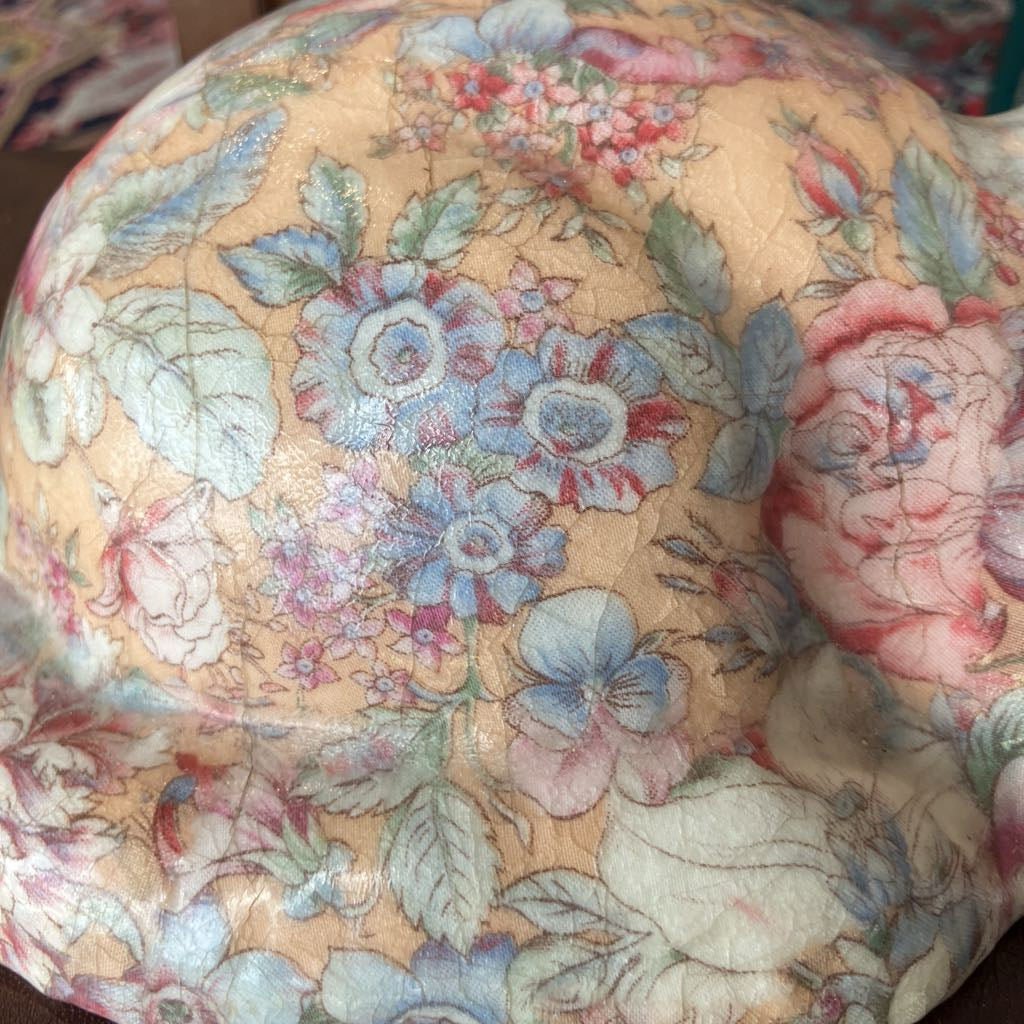 Floral patterned fabric with a focus on flowers and leaves.