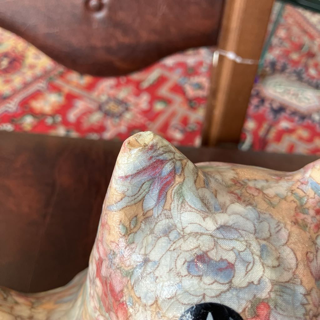 Decorative item with floral pattern on a blurred background