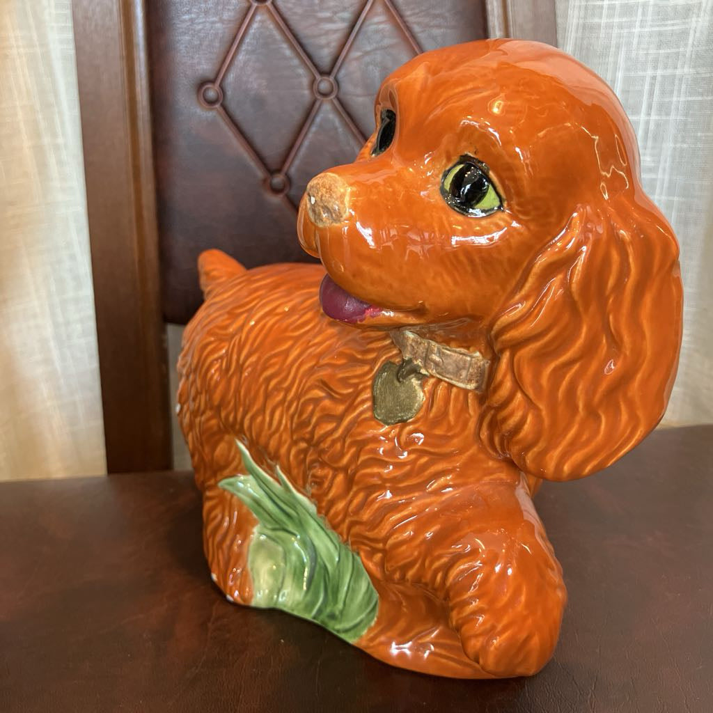 Ceramic dog-shaped cookie jar on a wooden surface