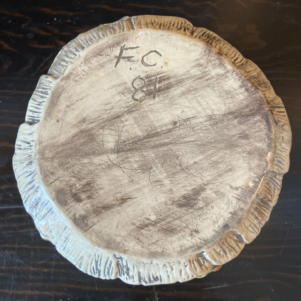Wooden log with markings on a dark surface