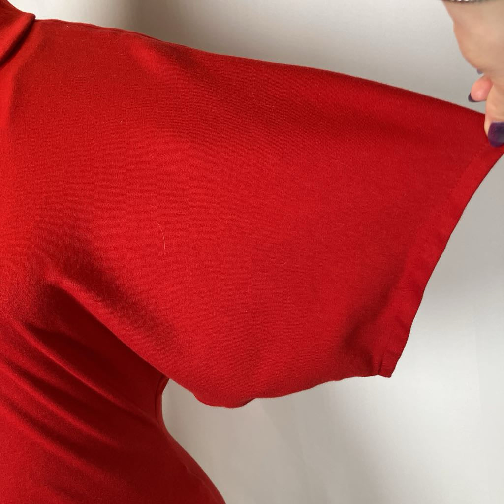 Close-up of a red garment with a plain background