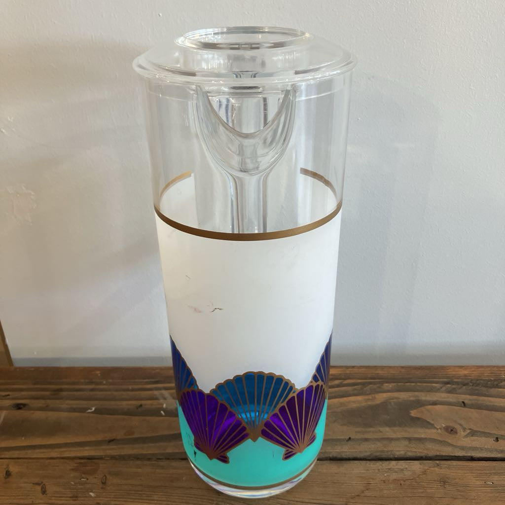Clear plastic with purple and gold design on a wooden surface
