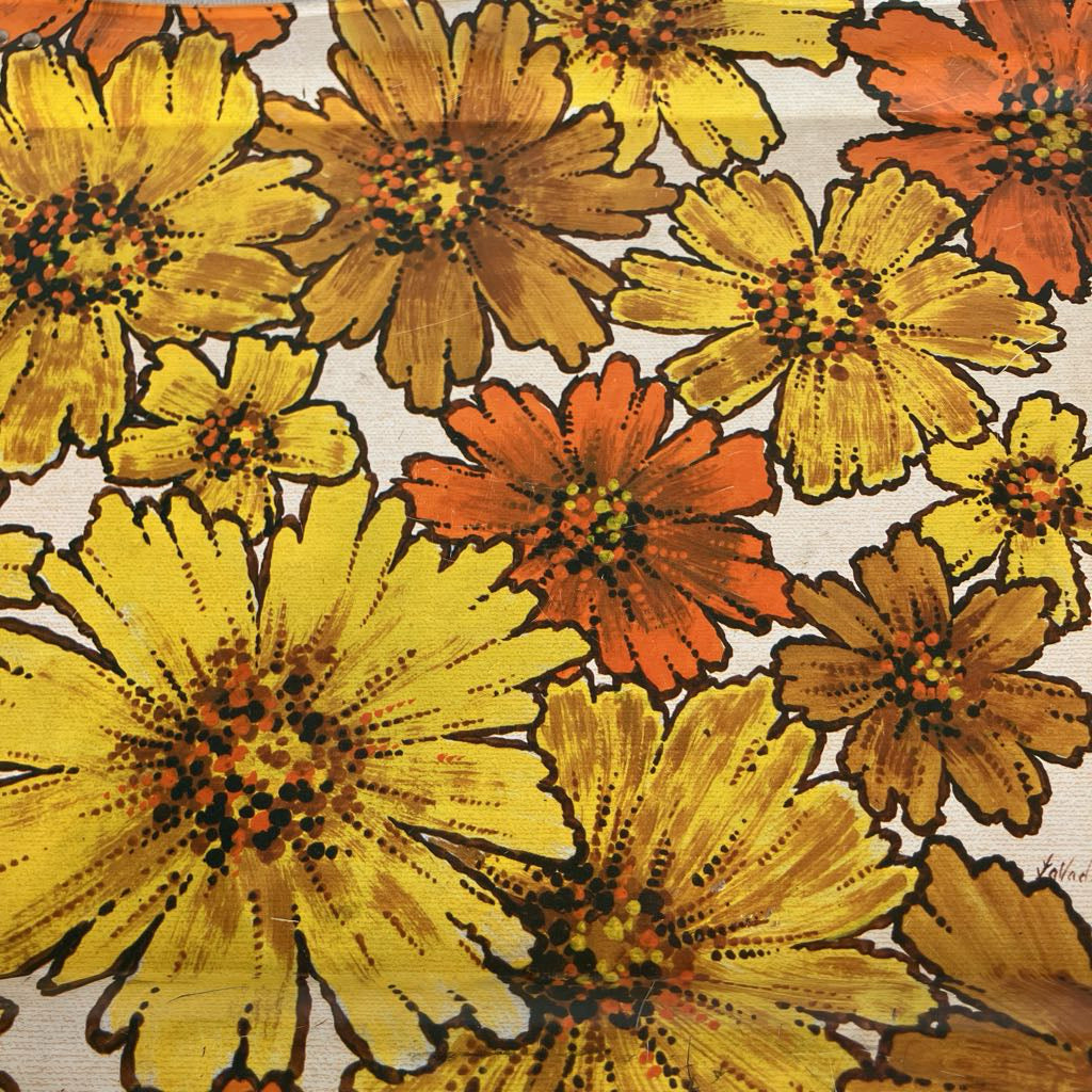 Pattern of yellow, orange, and brown flowers on a beige background