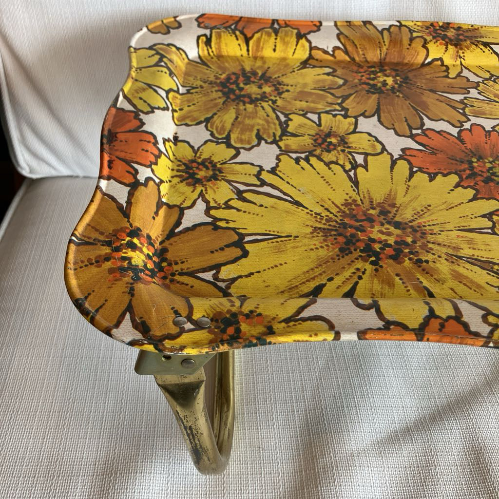 Small stool with a floral pattern on a light gray surface