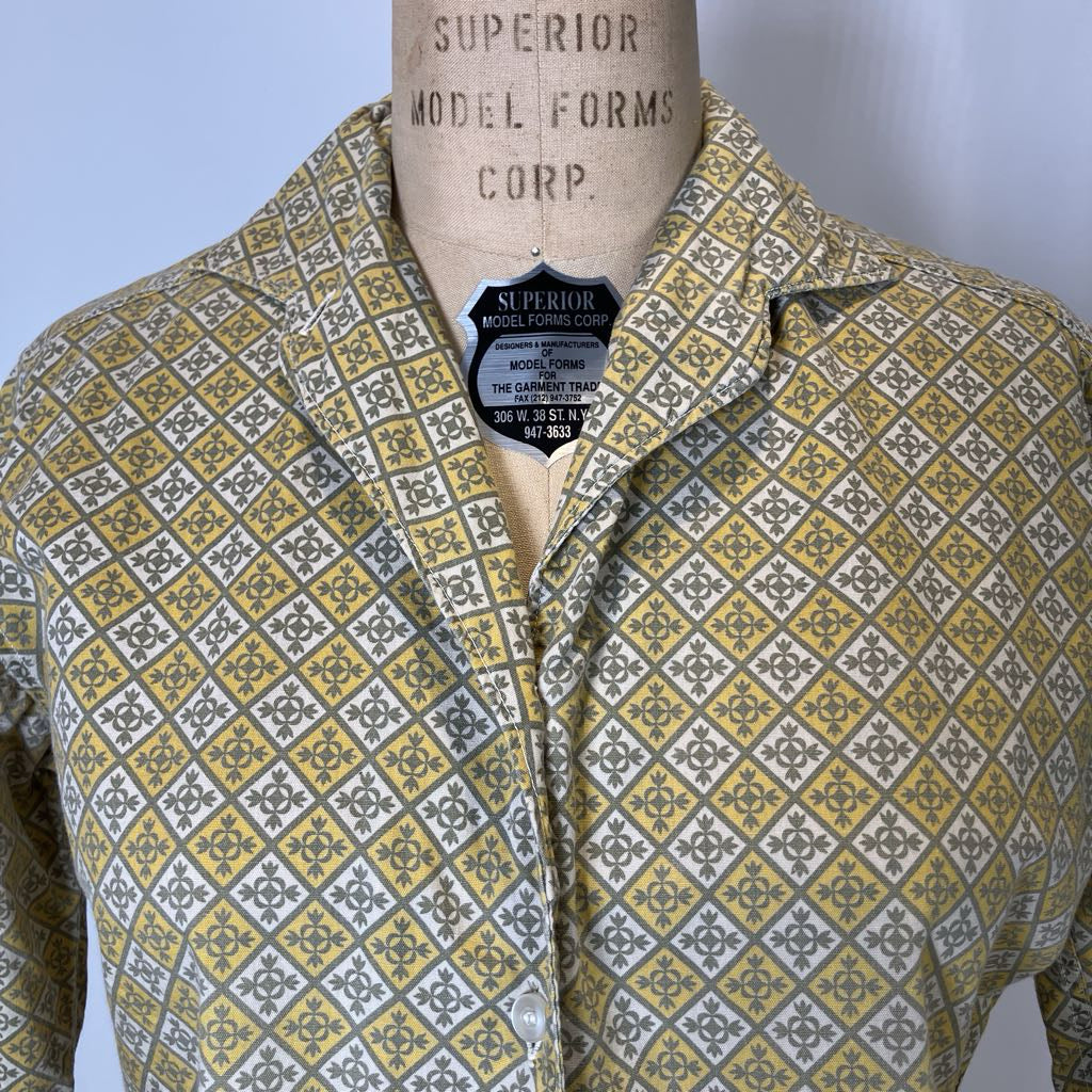 Mannequin wearing a patterned shirt with 'Superior Model Forms Corp.' label.