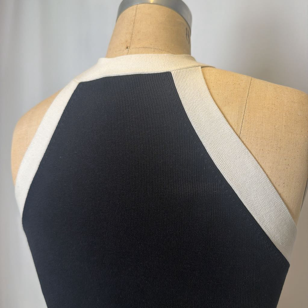 Black and white halter top on a mannequin with a plain background