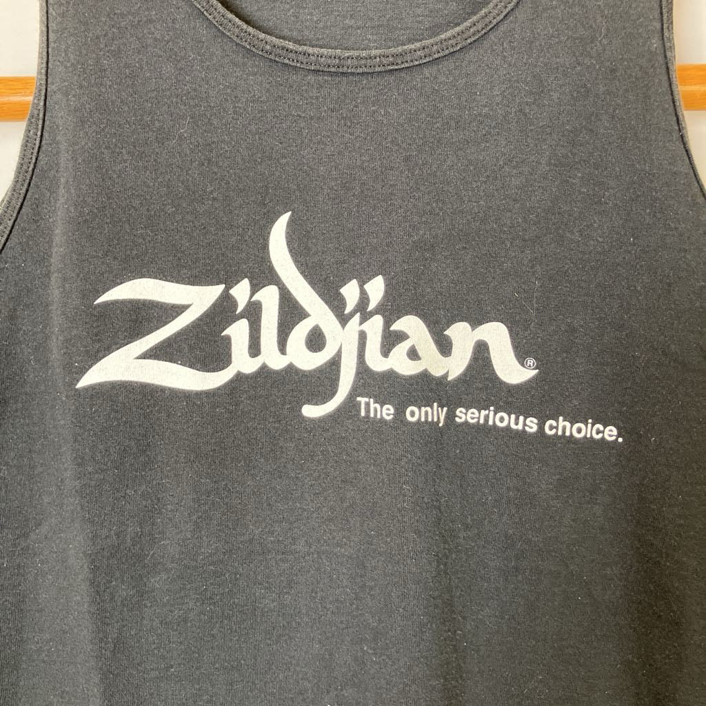 Gray tank top with Zildjian logo and text on a wooden surface