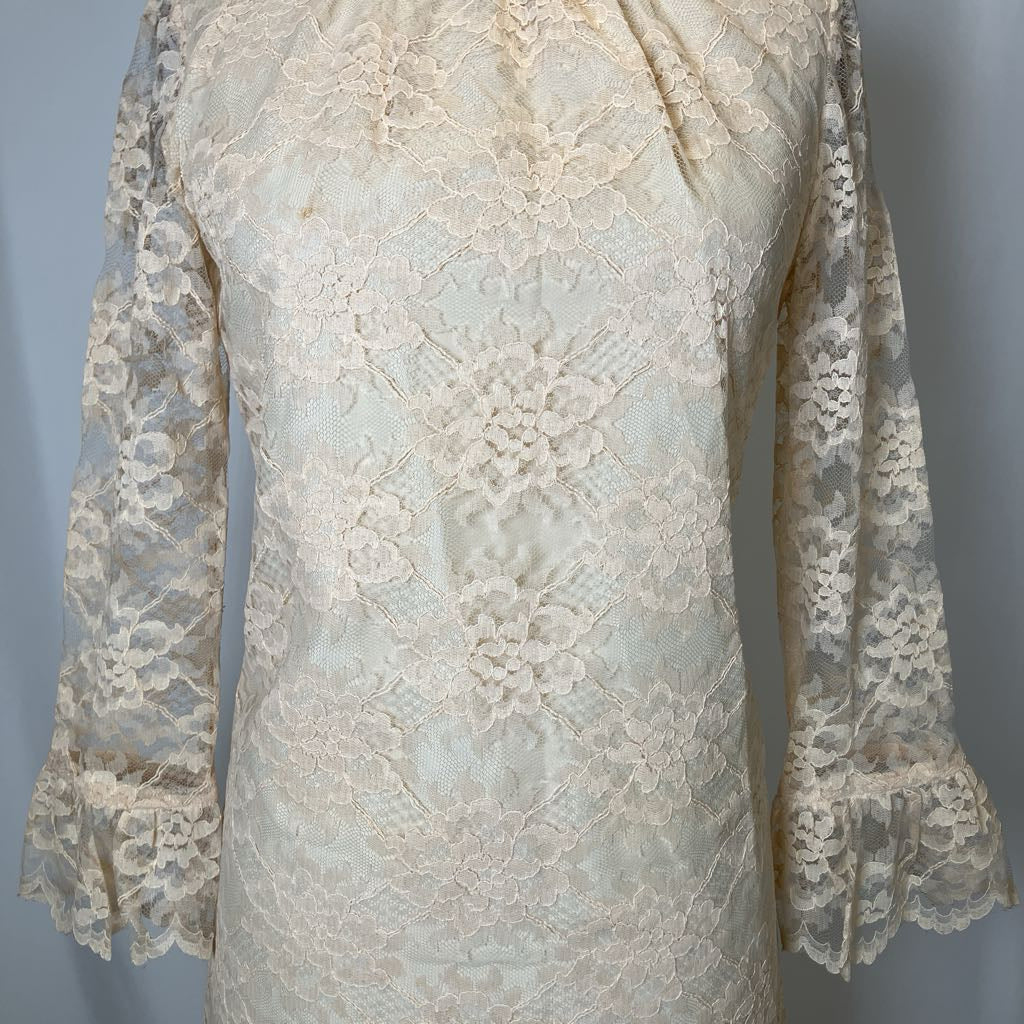 Close-up of a lace garment with a plain background