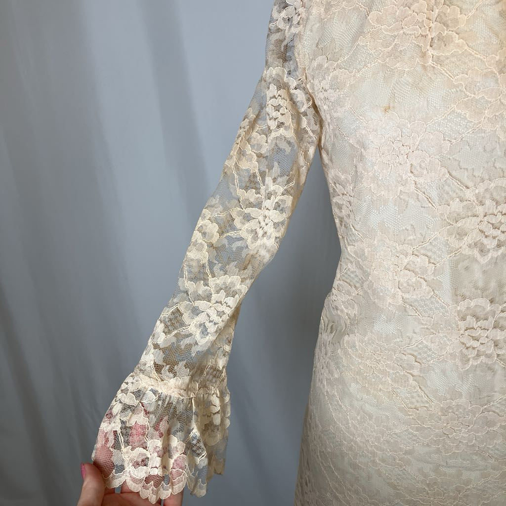 Close-up of a lace-trimmed garment with a plain background