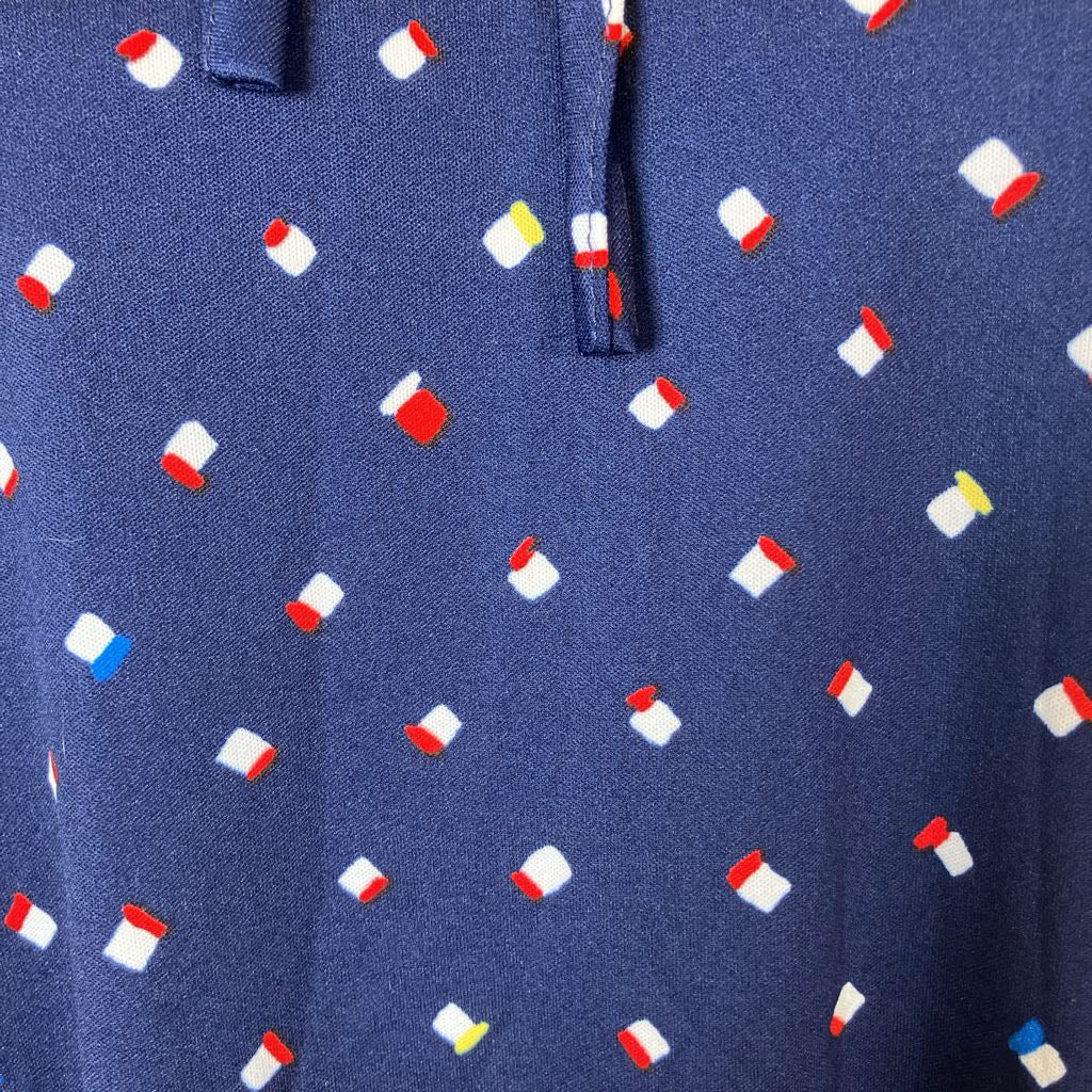 Navy blue polo shirt with small colorful pattern