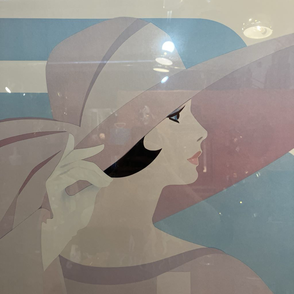 Artistic depiction of a woman with a large hat against a blue background