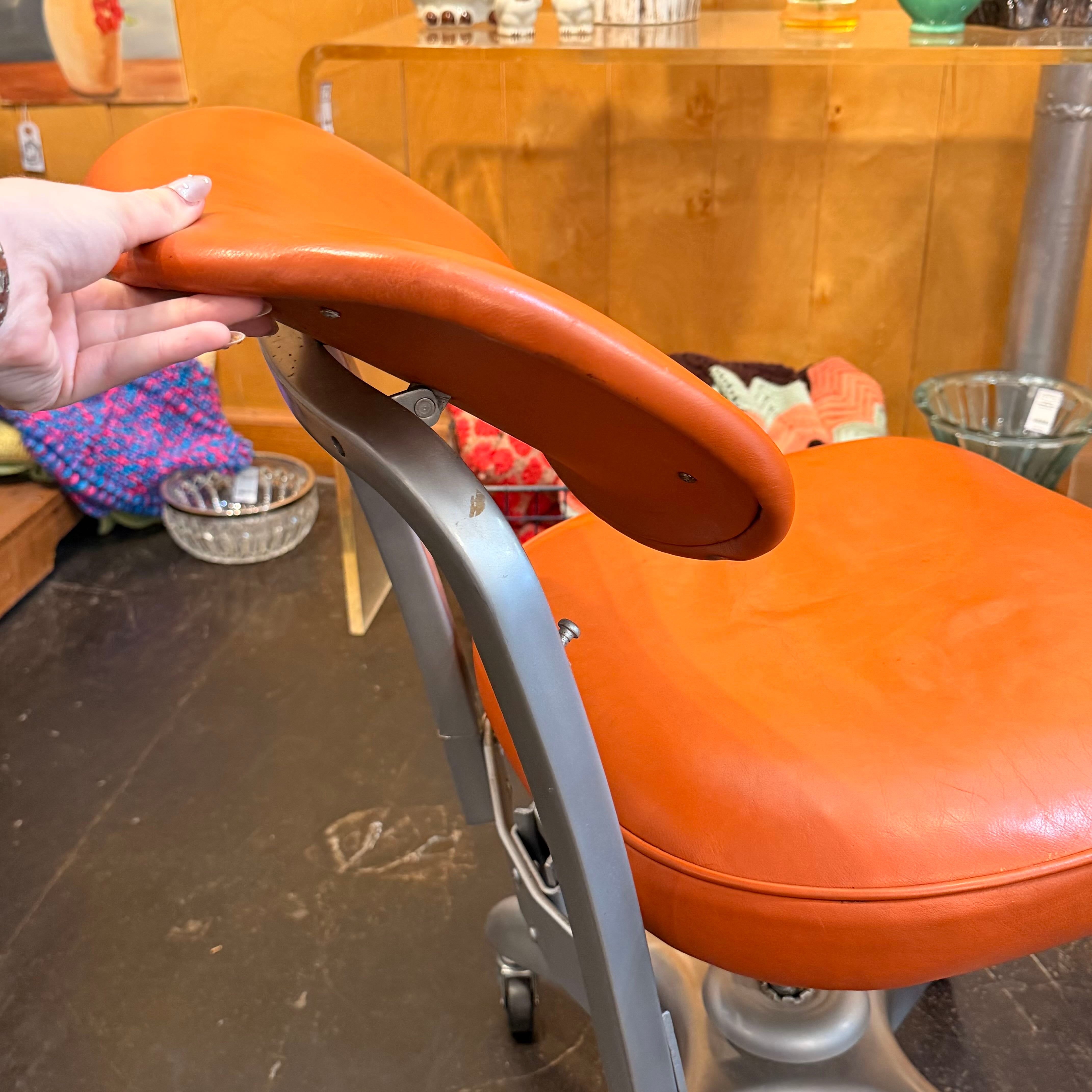 Orange chair with metal silver detailing