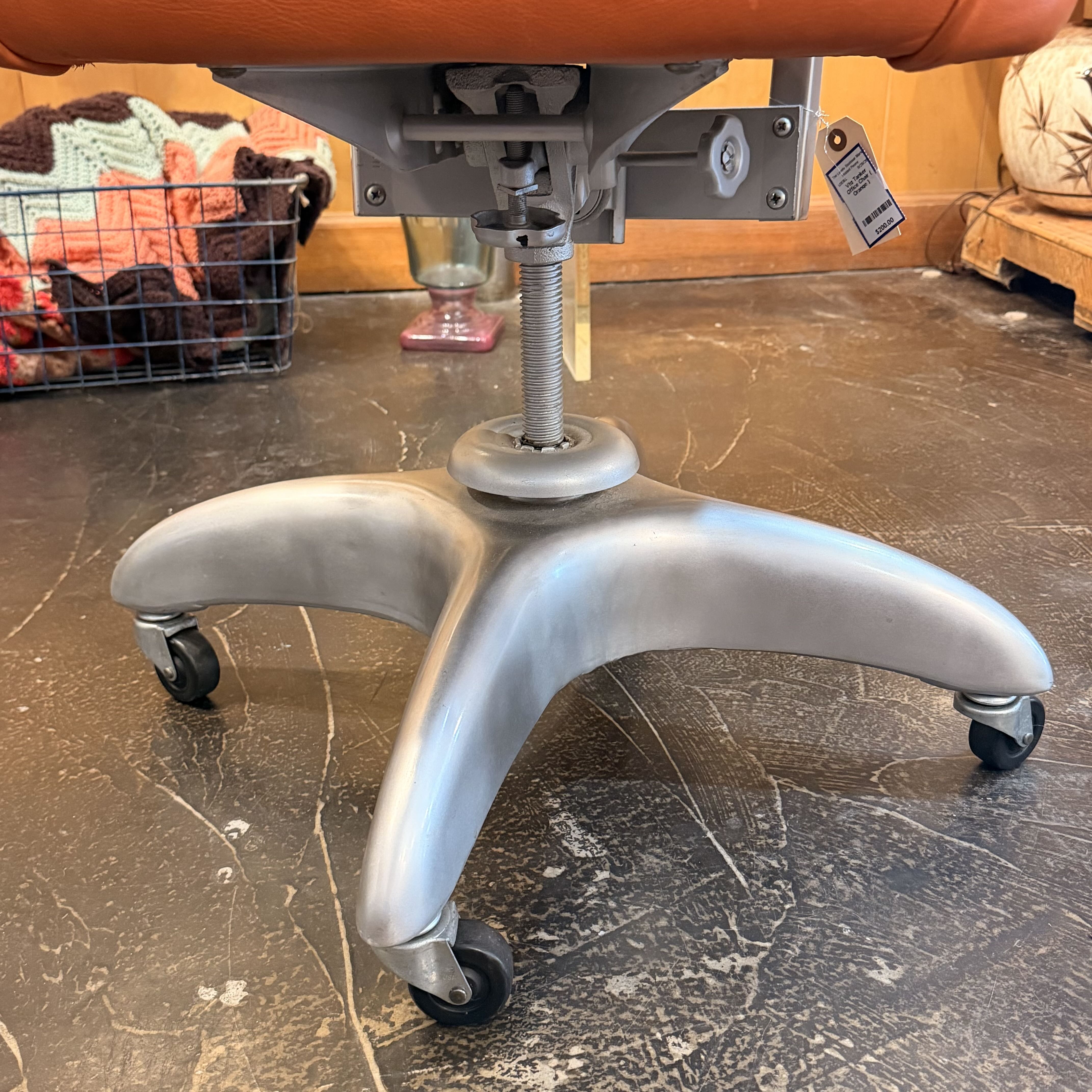 Orange chair with metal silver detailing