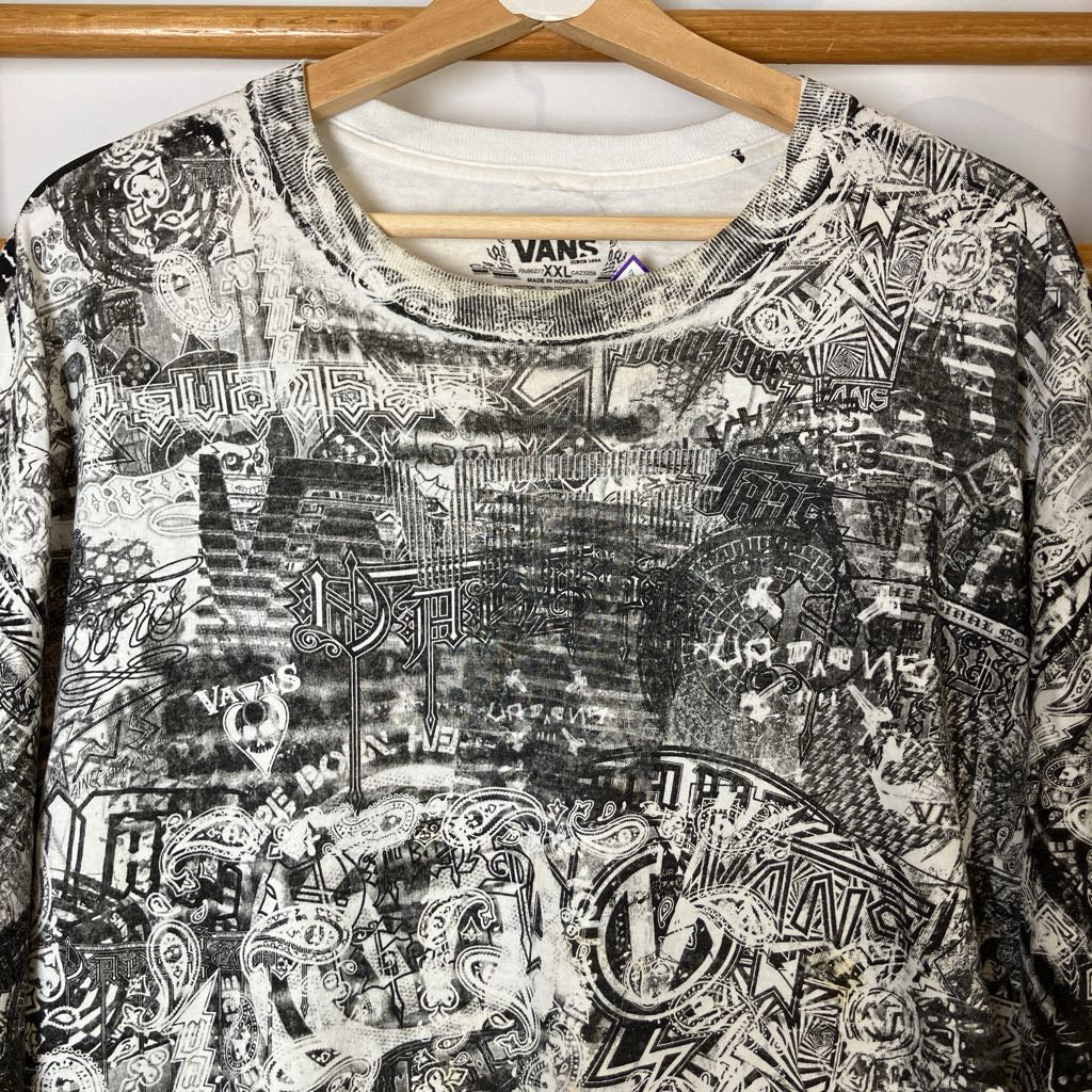 Black and white patterned shirt with Vans logo on a hanger