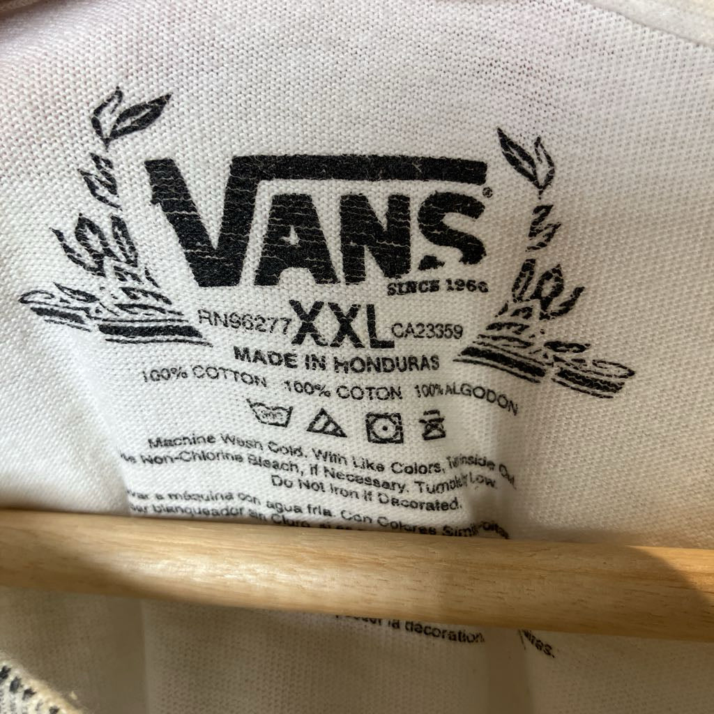 Vans label on a product with text and branding details.