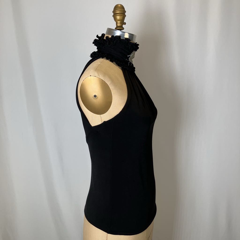 Black sleeveless top on a mannequin against a plain background