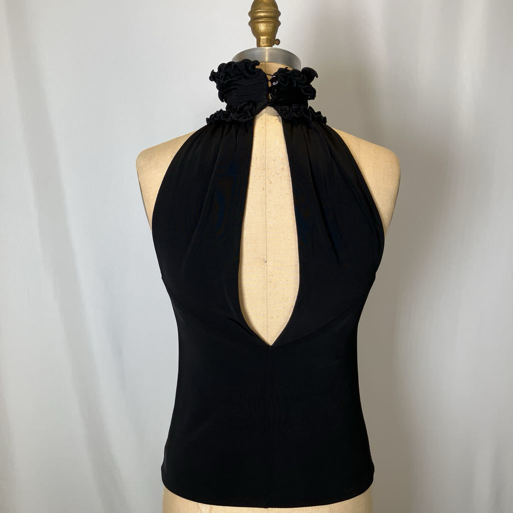 Black halter top with floral details on a mannequin against a plain background