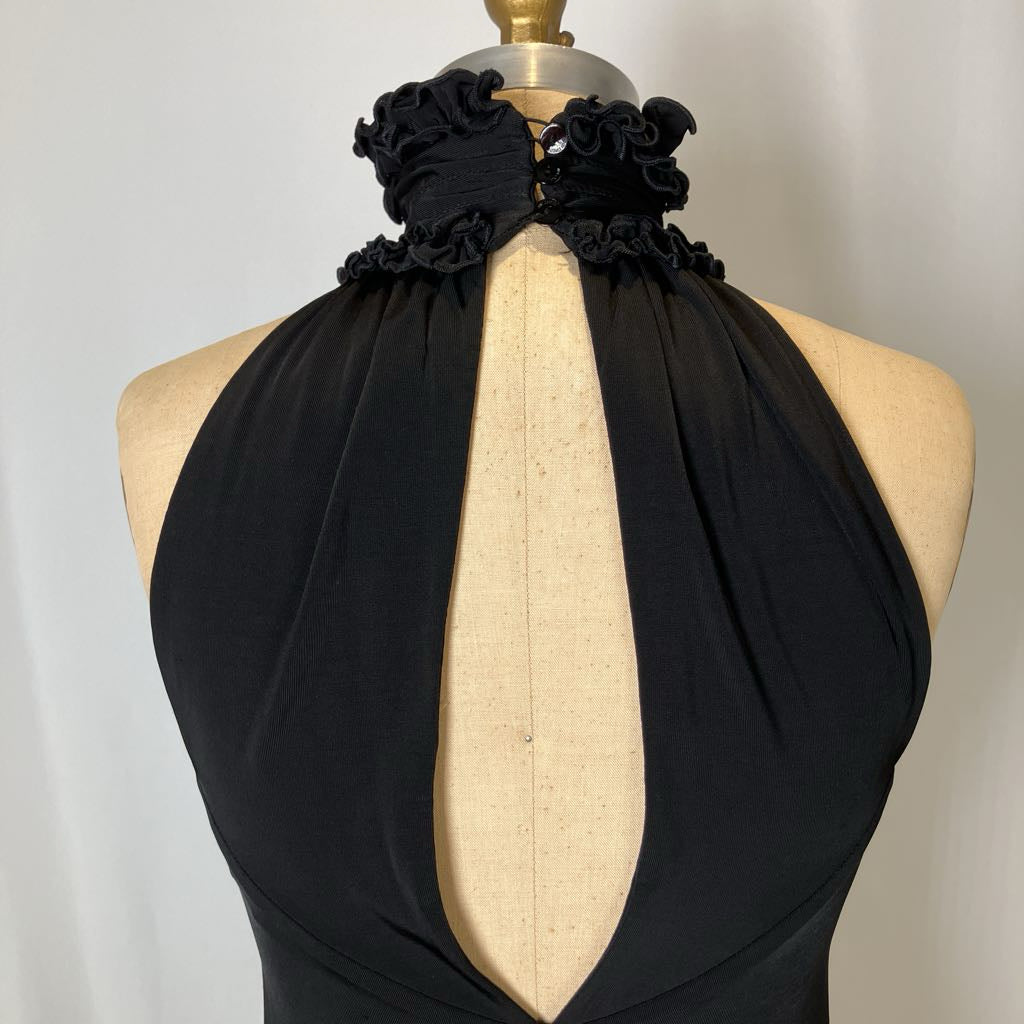 Black halter top with floral accents on a mannequin against a plain background
