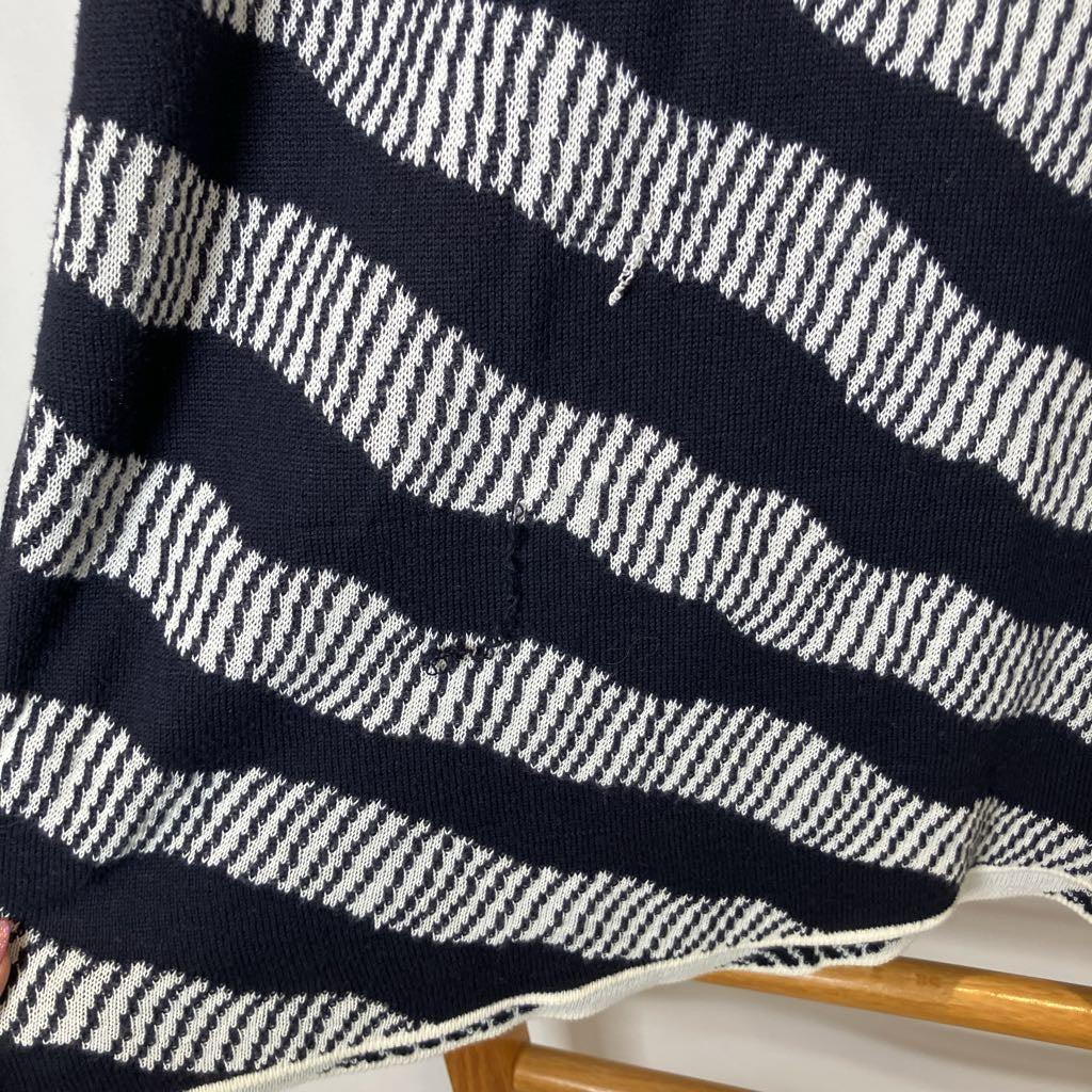 Close-up of a navy blue and white striped fabric on a hanger.