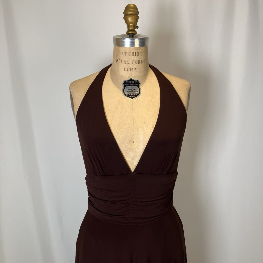Brown dress on a mannequin against a plain background