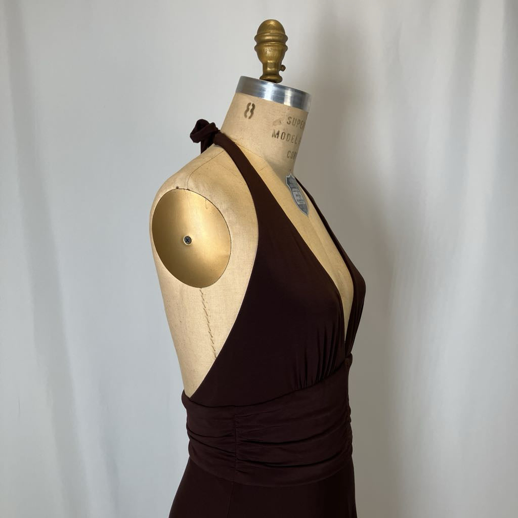Brown dress on a mannequin against a plain background