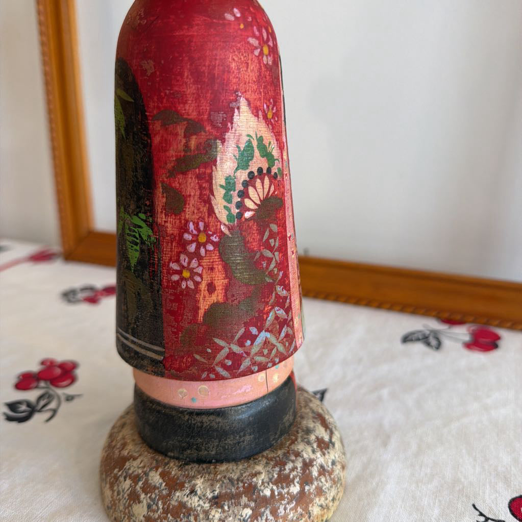 Bottom of Vintage Kokeshi doll made of wood and her head moves