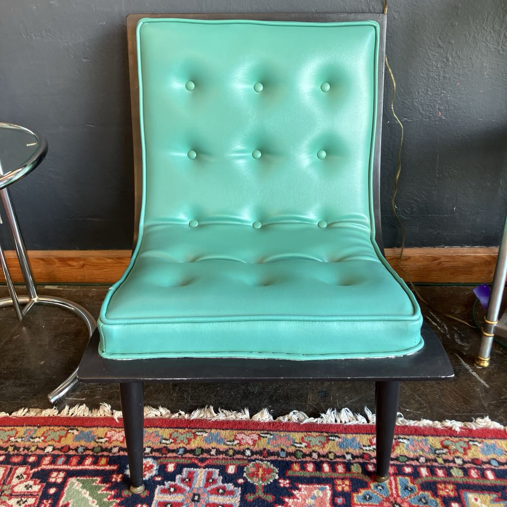 Front of tufted turquoise chair