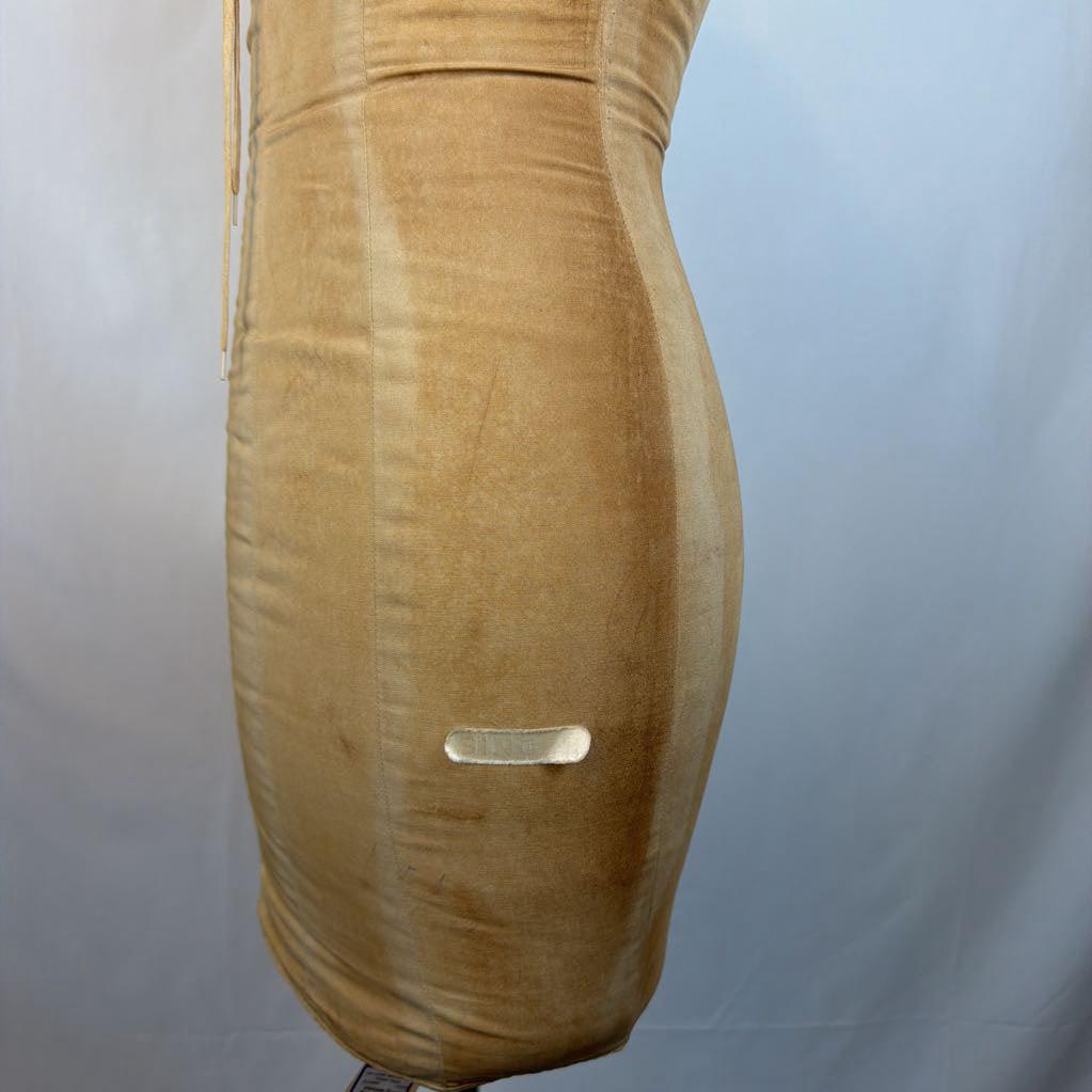 A tan velvet or velour fitted dress or bodysuit shown on a dress form against a light gray studio backdrop.