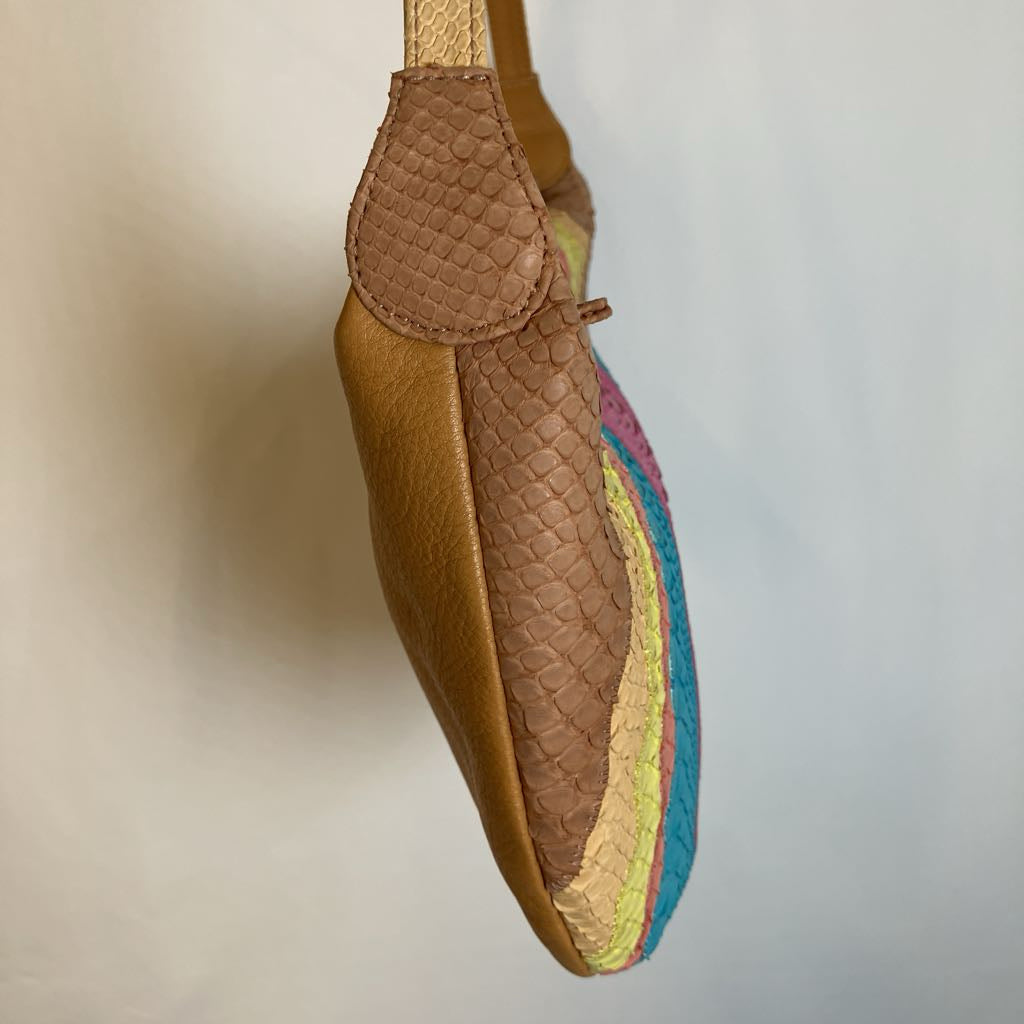A brown leather shoulder bag with a textured python-patterned panel and a colorful striped trim in yellow, pink, and blue, shown against a plain light gray background.