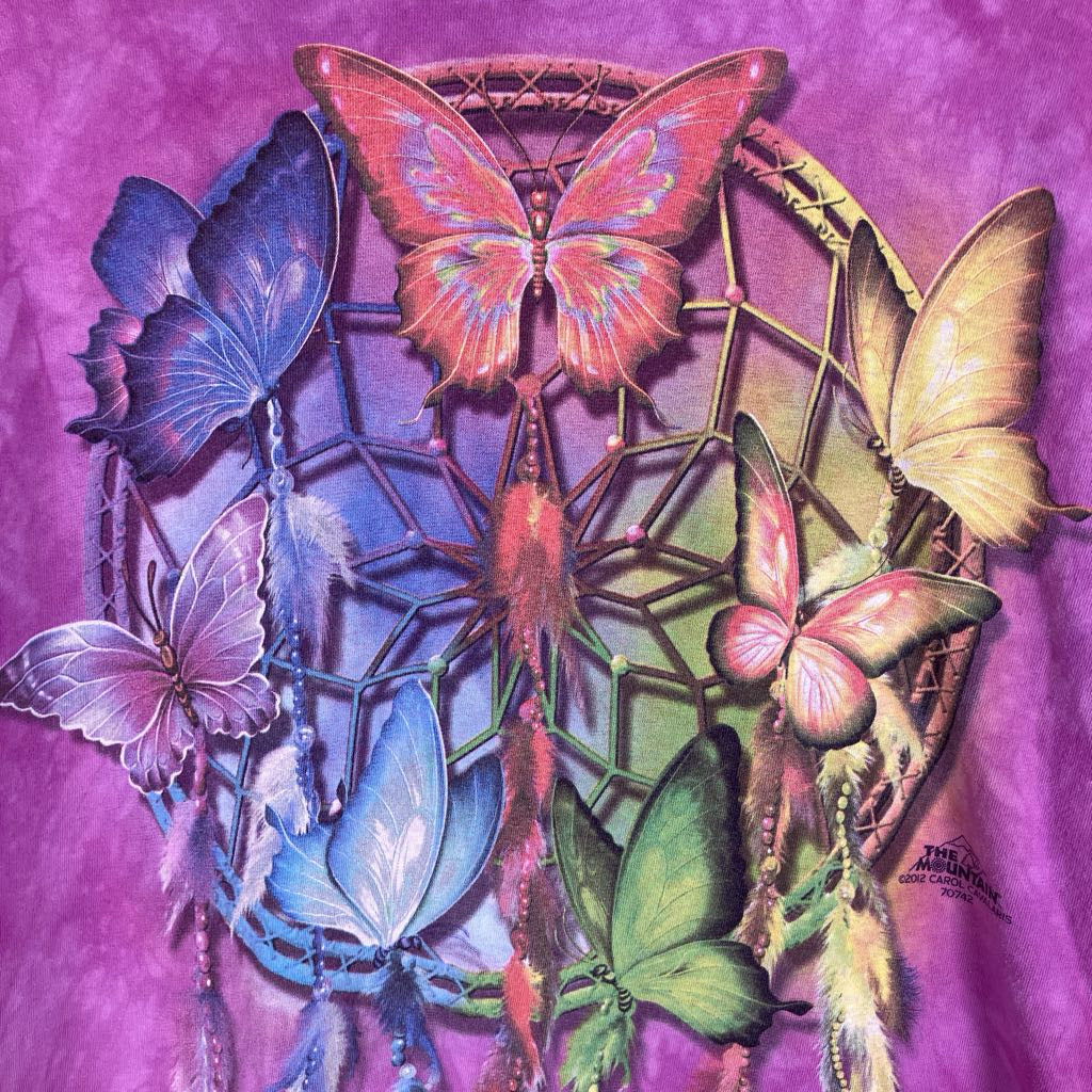 A colorful dreamcatcher-style graphic with multiple illustrated butterflies in pink, blue, green, yellow, and purple on a purple background.