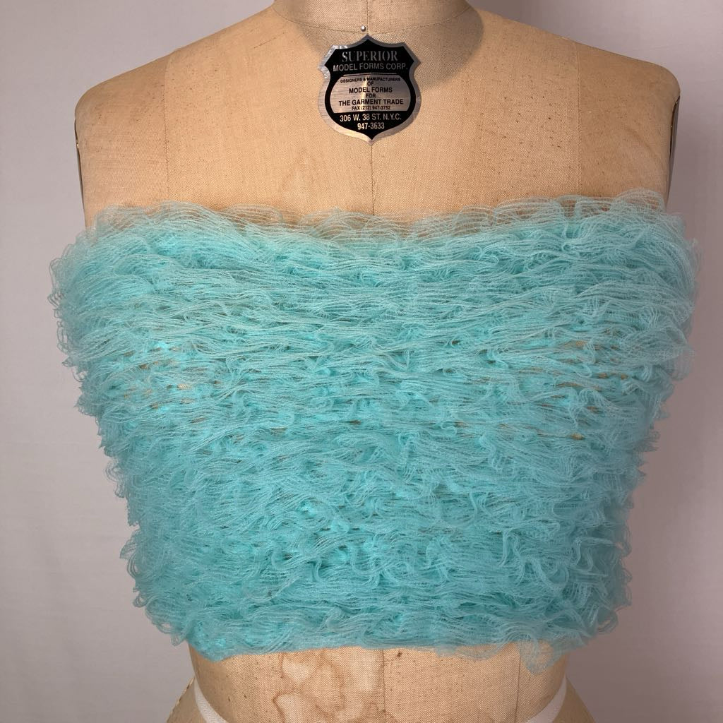 A light aqua blue fuzzy knit bandeau top displayed on a tan dress form mannequin against a plain light background.