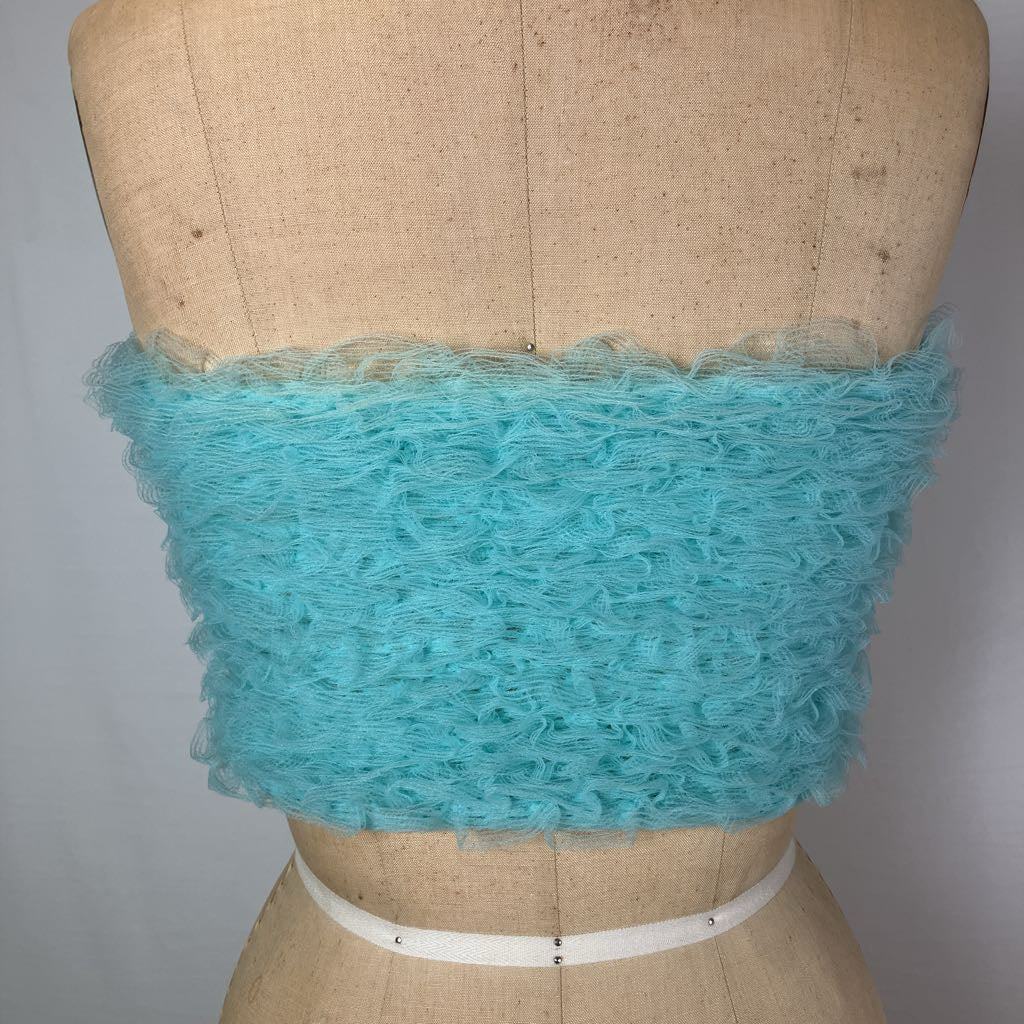 A turquoise blue ruffled mesh bandeau top displayed on a tan fabric mannequin torso against a light gray background.