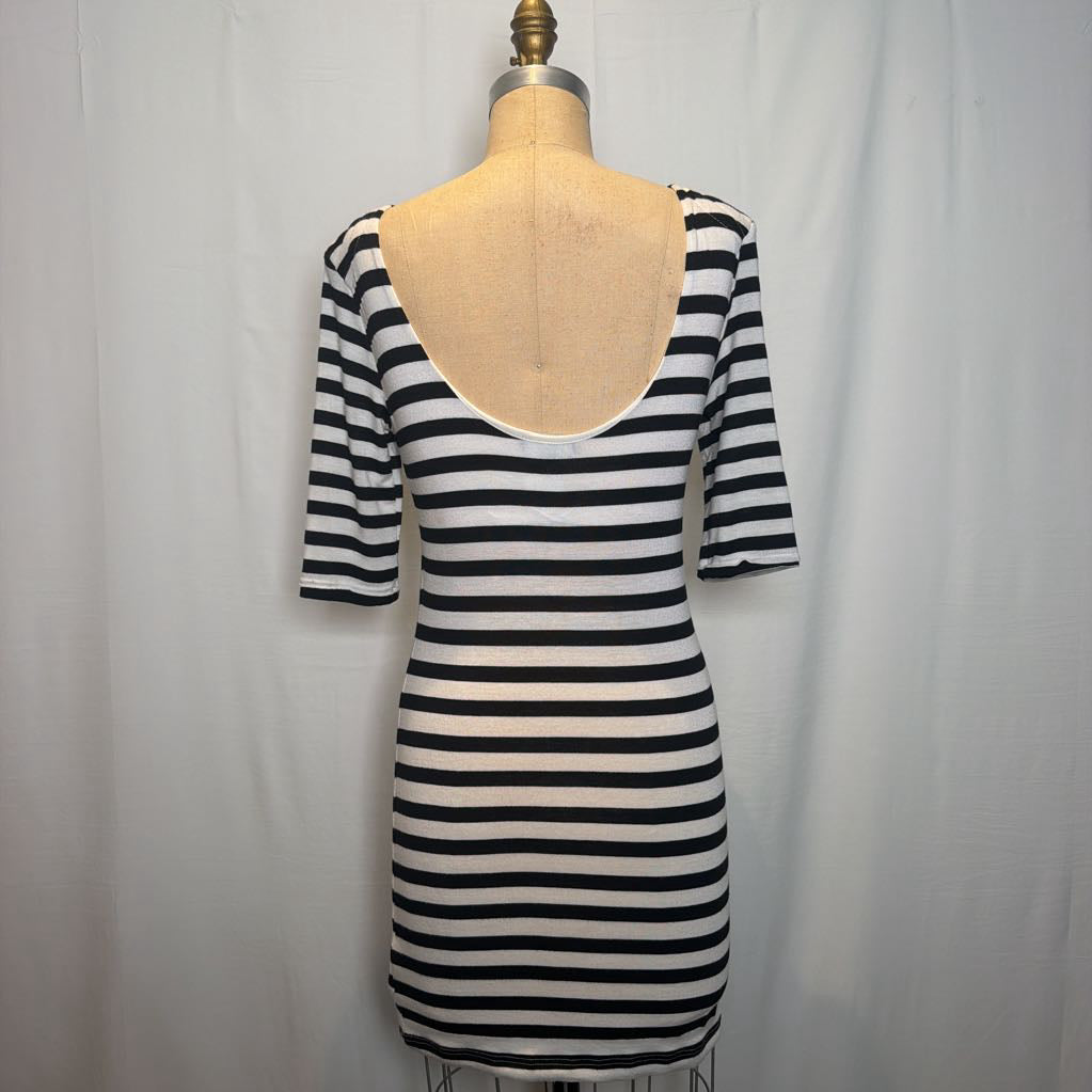 A black and white horizontally striped short-sleeve bodycon dress displayed on a beige dress form mannequin against a white fabric backdrop.