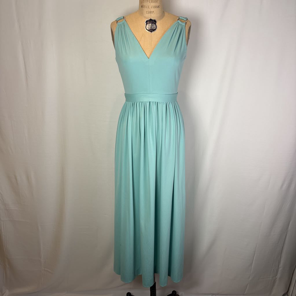 A sleeveless mint green maxi dress displayed on a dress form mannequin against a white fabric backdrop.