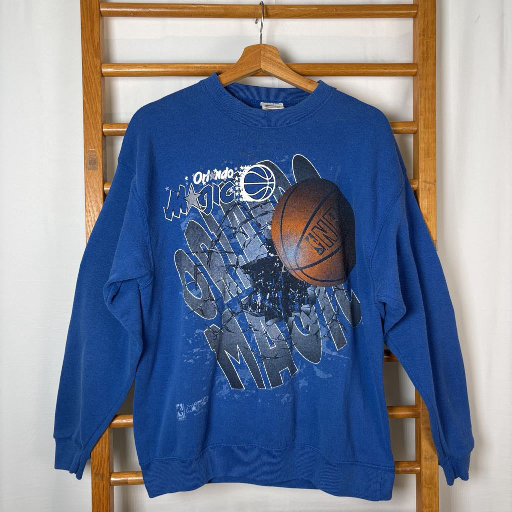 A blue sweatshirt with Orlando Magic branding and the image of a basketball on the front.
