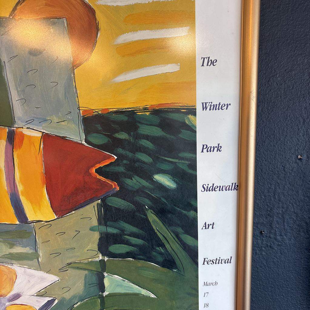 A colorful abstract artwork of fishes with the words, "36th Annual The Winter Park Sidewalk Art Festival" around the edge of the work.