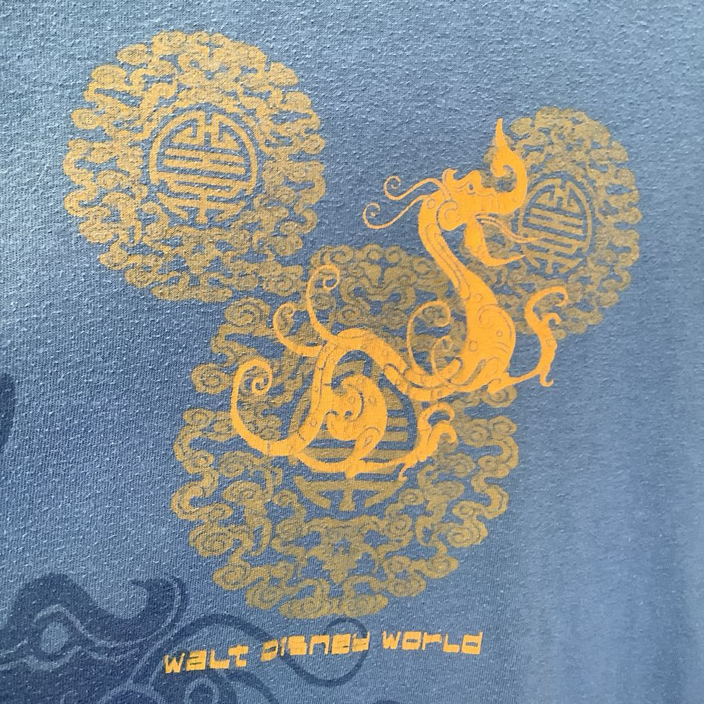 Blue shirt with yellow dragon design and 'Walt Disney World' text