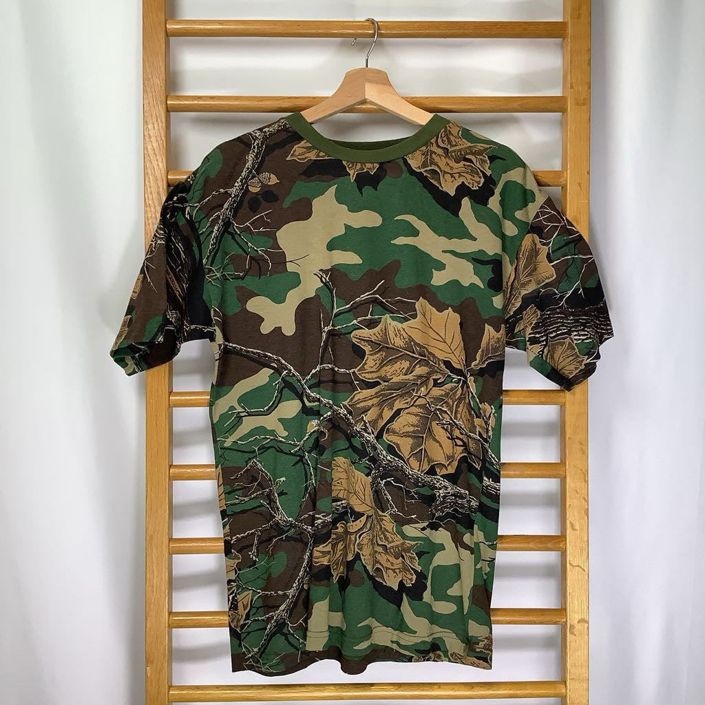 Camouflage-patterned shirt on a wooden hanger against a white background