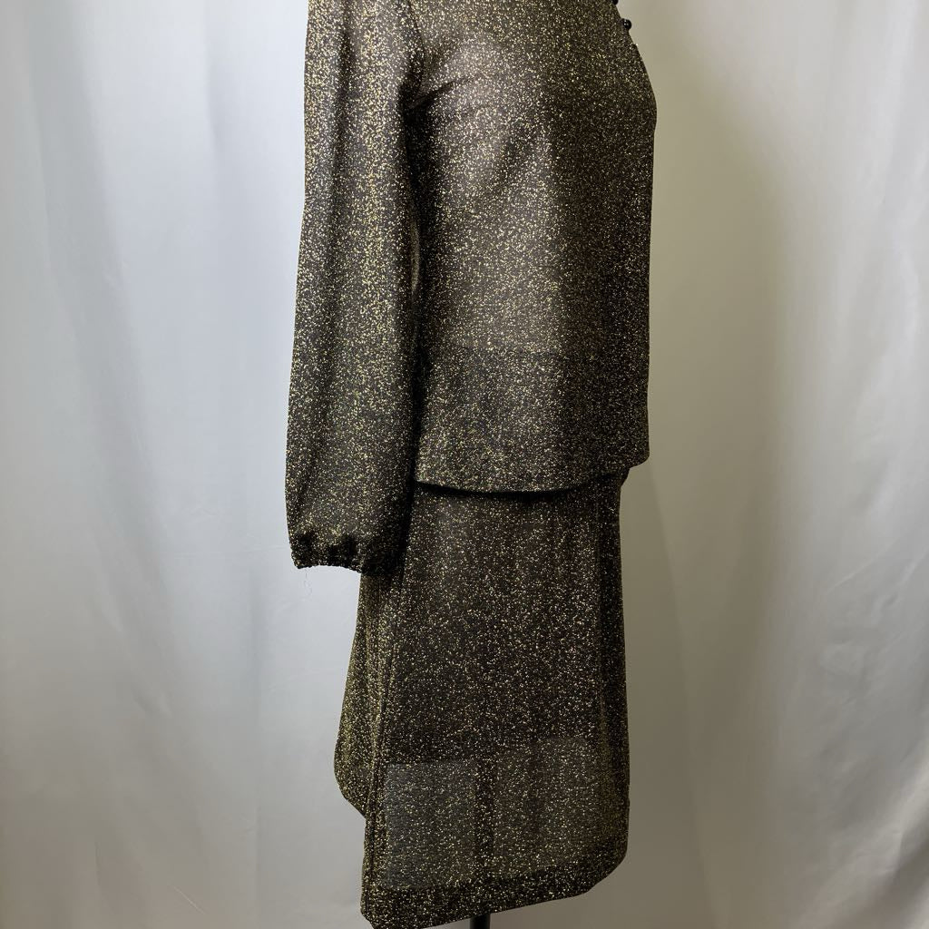 Black sparkly skirt suit on a white background