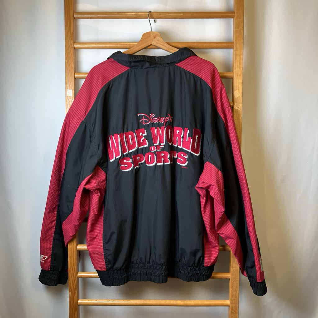 Black and red jacket with 'Disney's Wide World of Sports' text on a wooden rack.