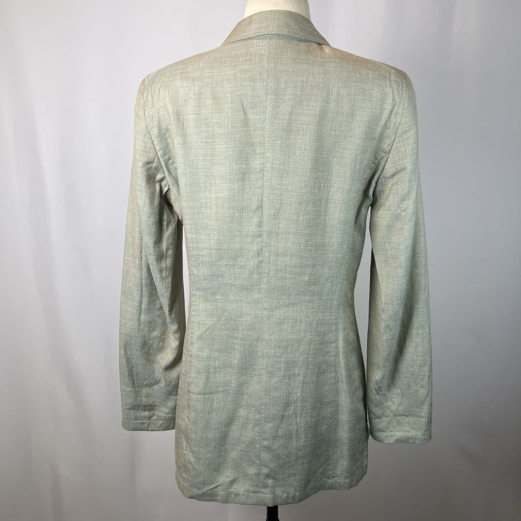 Green textured jacket on a mannequin against a white background