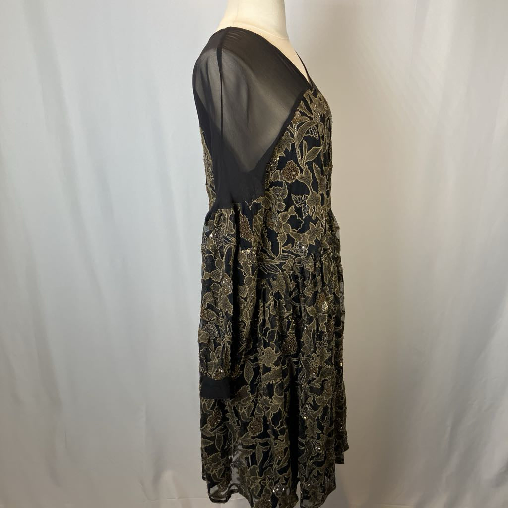Black floral lace dress on a mannequin against a white background
