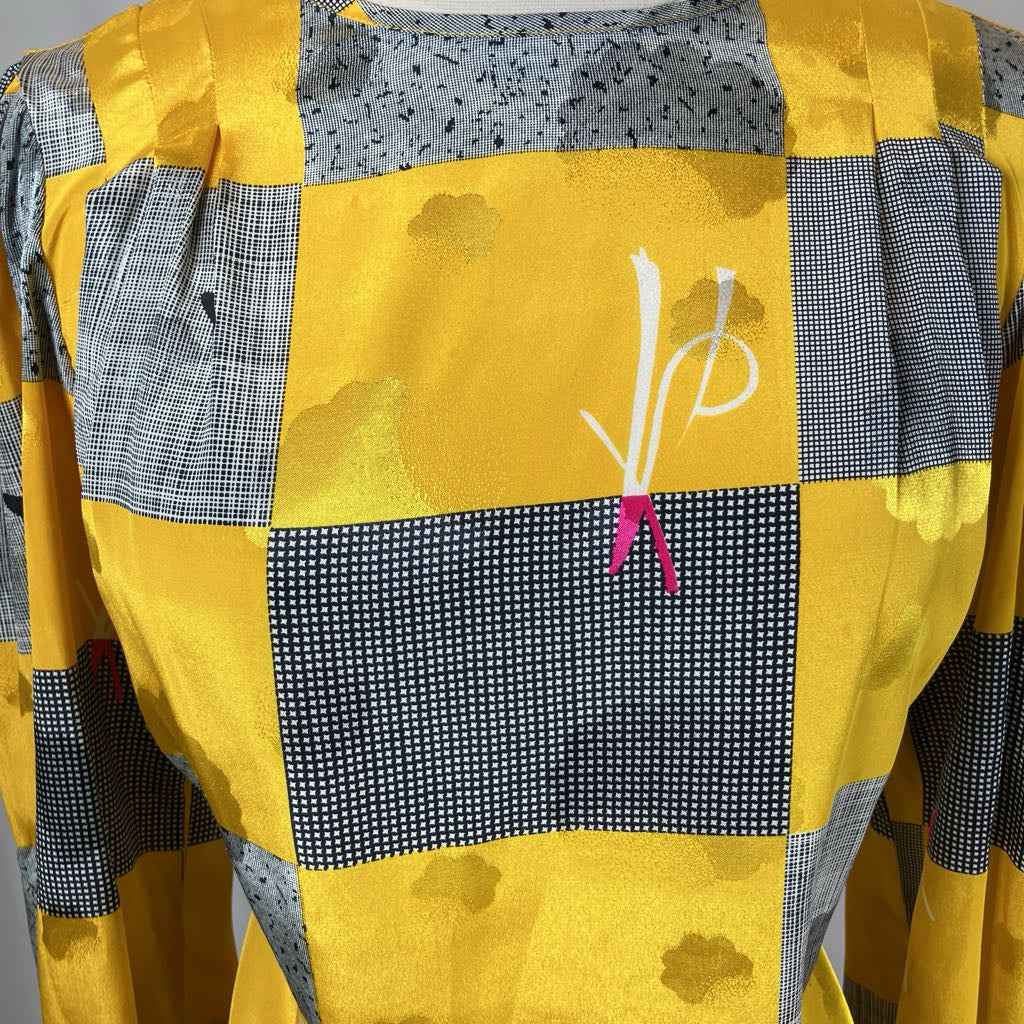 Close up of patchwork design on mannequin