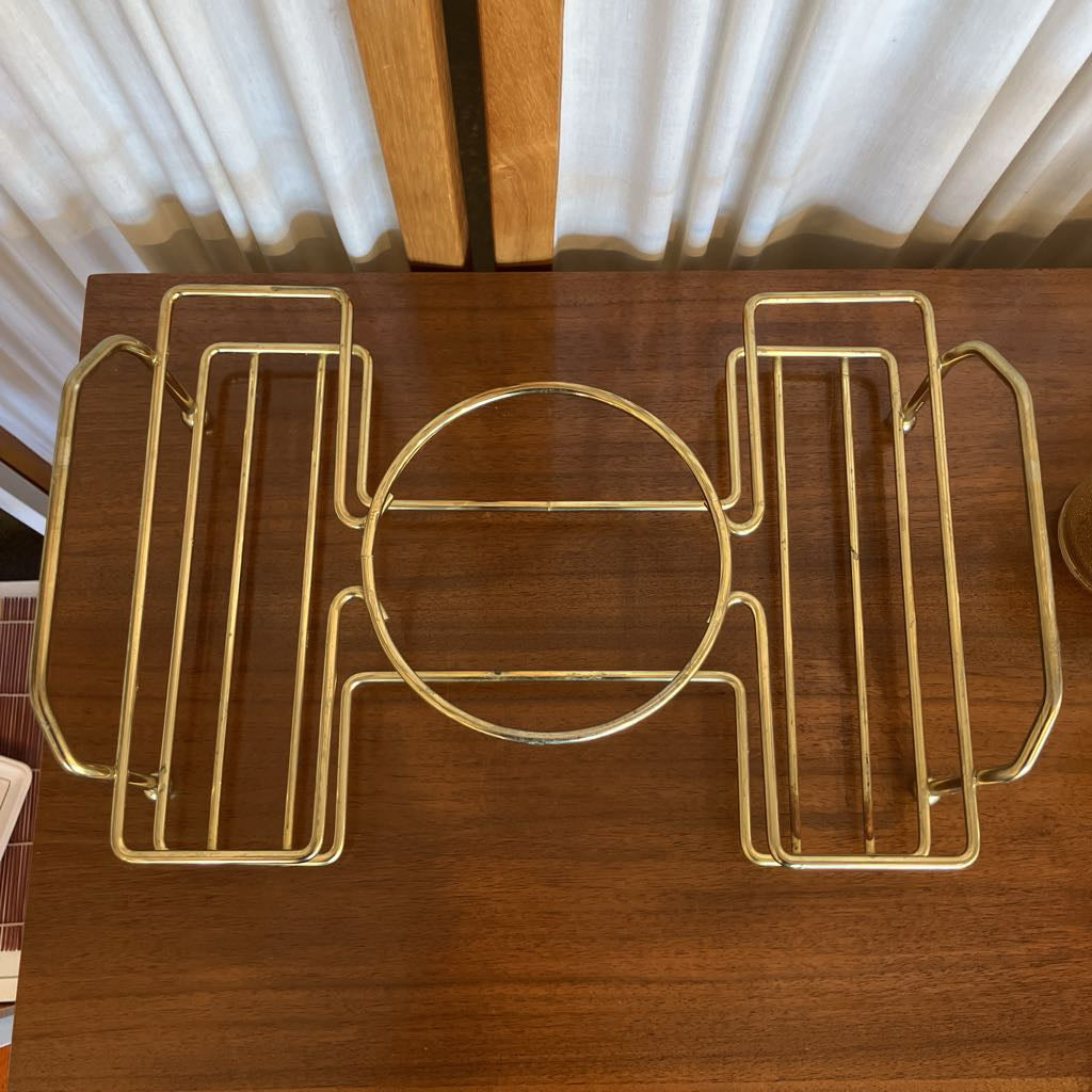 Over head view of gold metal tray on a wooden surface 