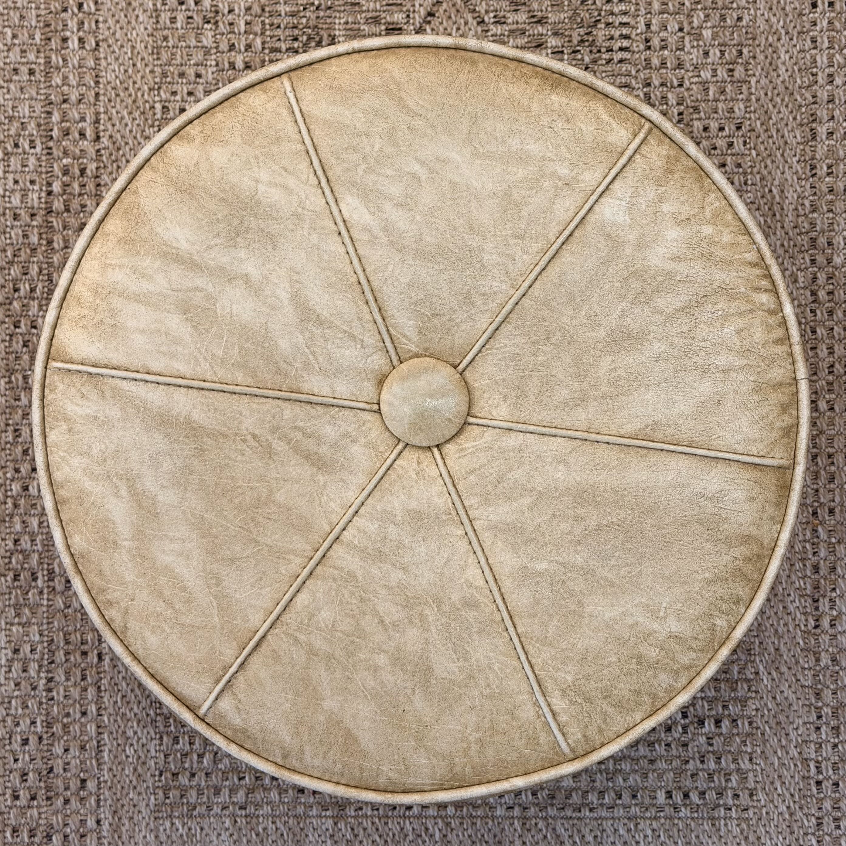 top of ottoman against a rug background