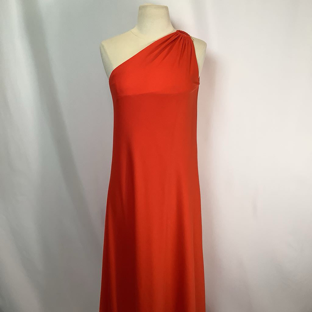 Red one-shoulder dress on a mannequin against a plain background