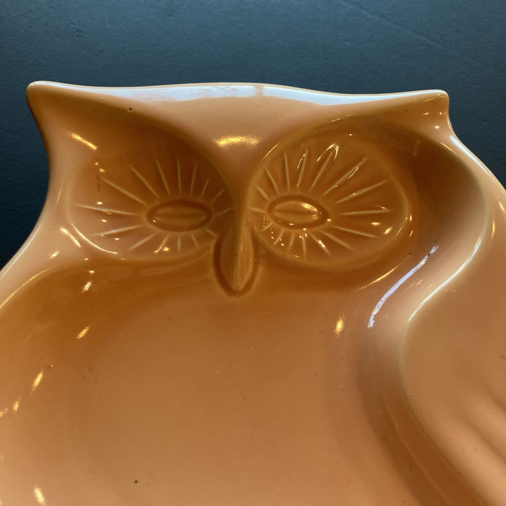 Owl-shaped ceramic bowl on a dark background
