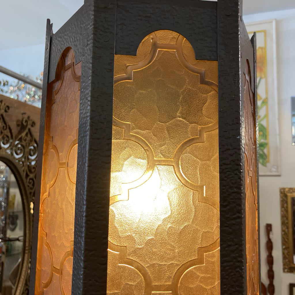 Decorative lamp with gold patterned glass and dark frame