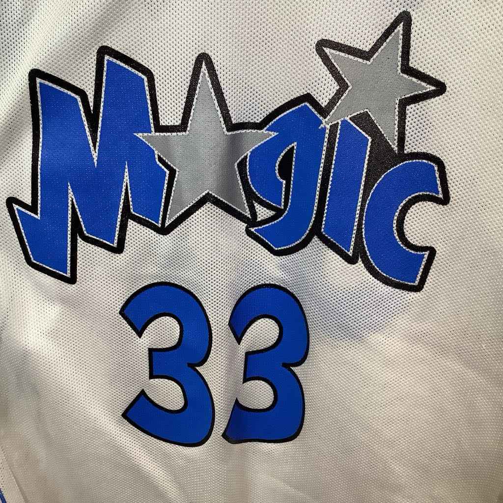 Close-up of 'Magic 33' logo on a sports jersey