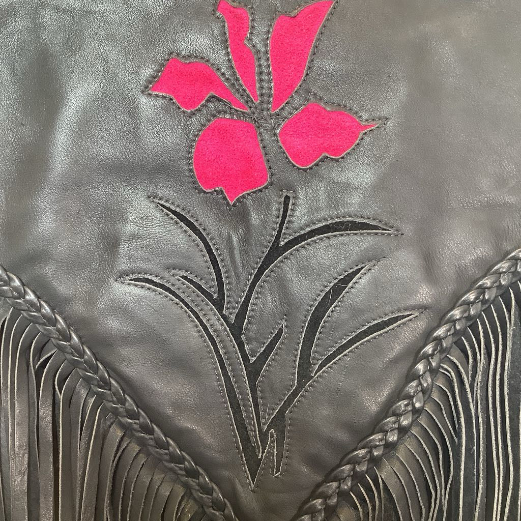 Gray leather jacket with pink floral applique and braided details